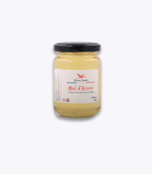pot de miel d'acacia sur fond gris